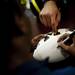Michigan senior quarterback Denard Robinson signs a football at The M-Den in Ann Arbor on Saturday, Feb. 2. Daniel Brenner I AnnArbor.com